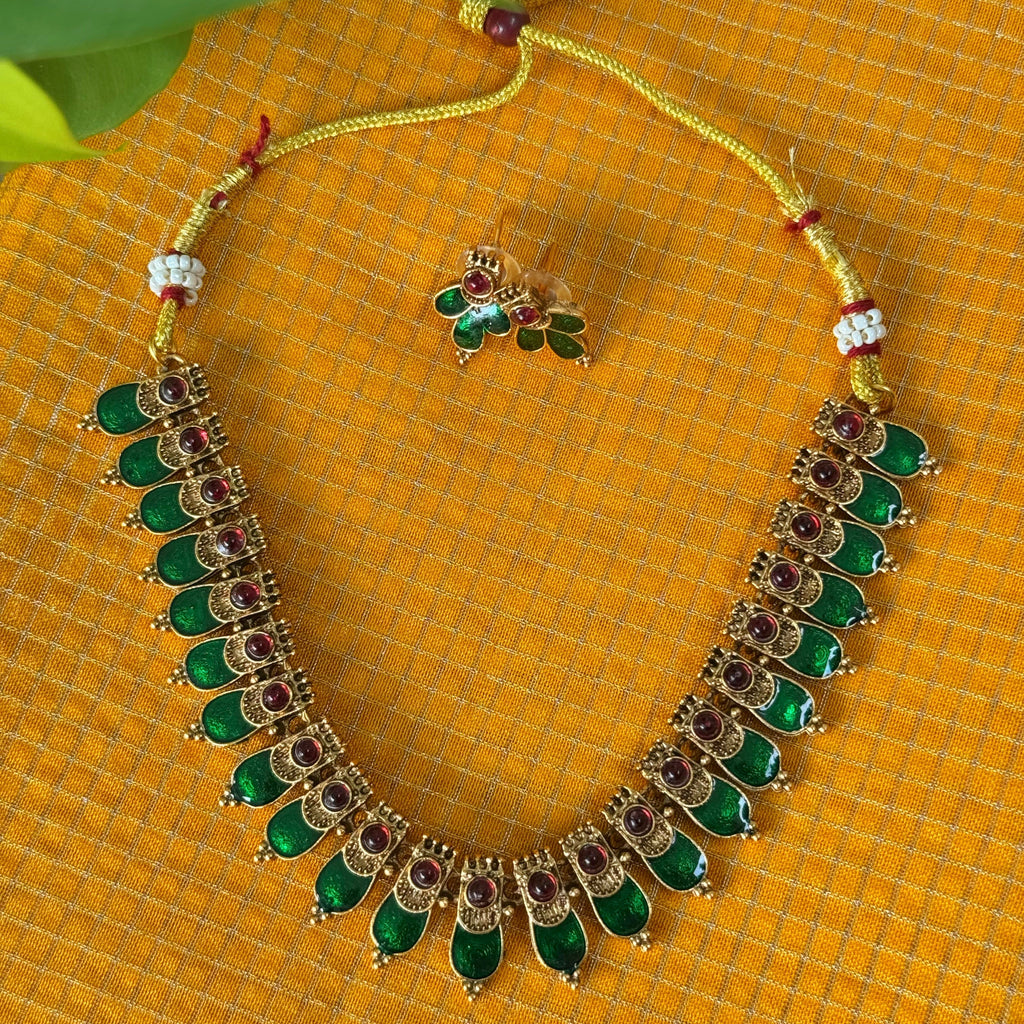 Ornate necklace with green stones 