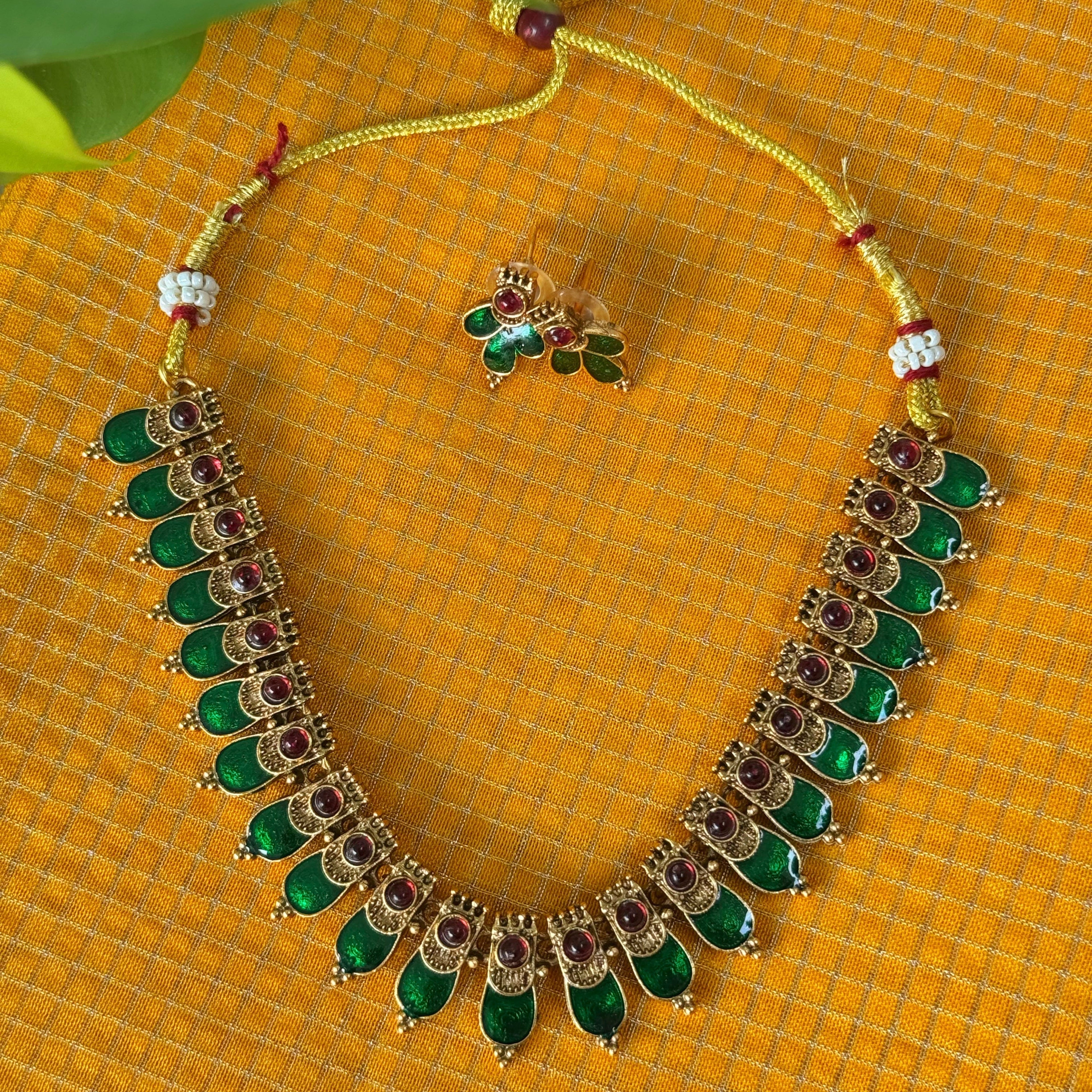 Ornate necklace with green stones 
